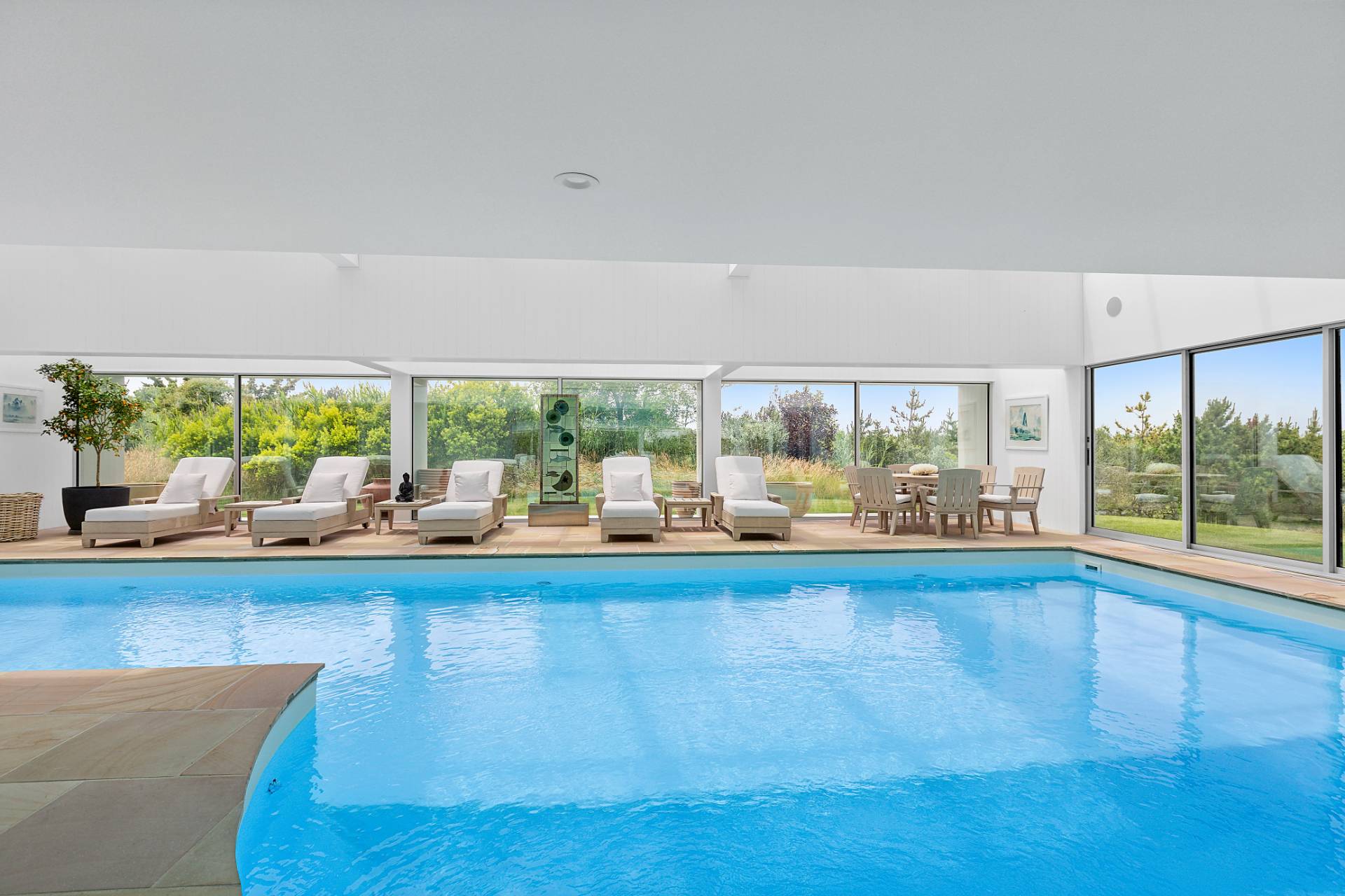 Undisclosed Address Southampton, NY 11968 - Photo 23 of 43 a living room with furniture and a large window