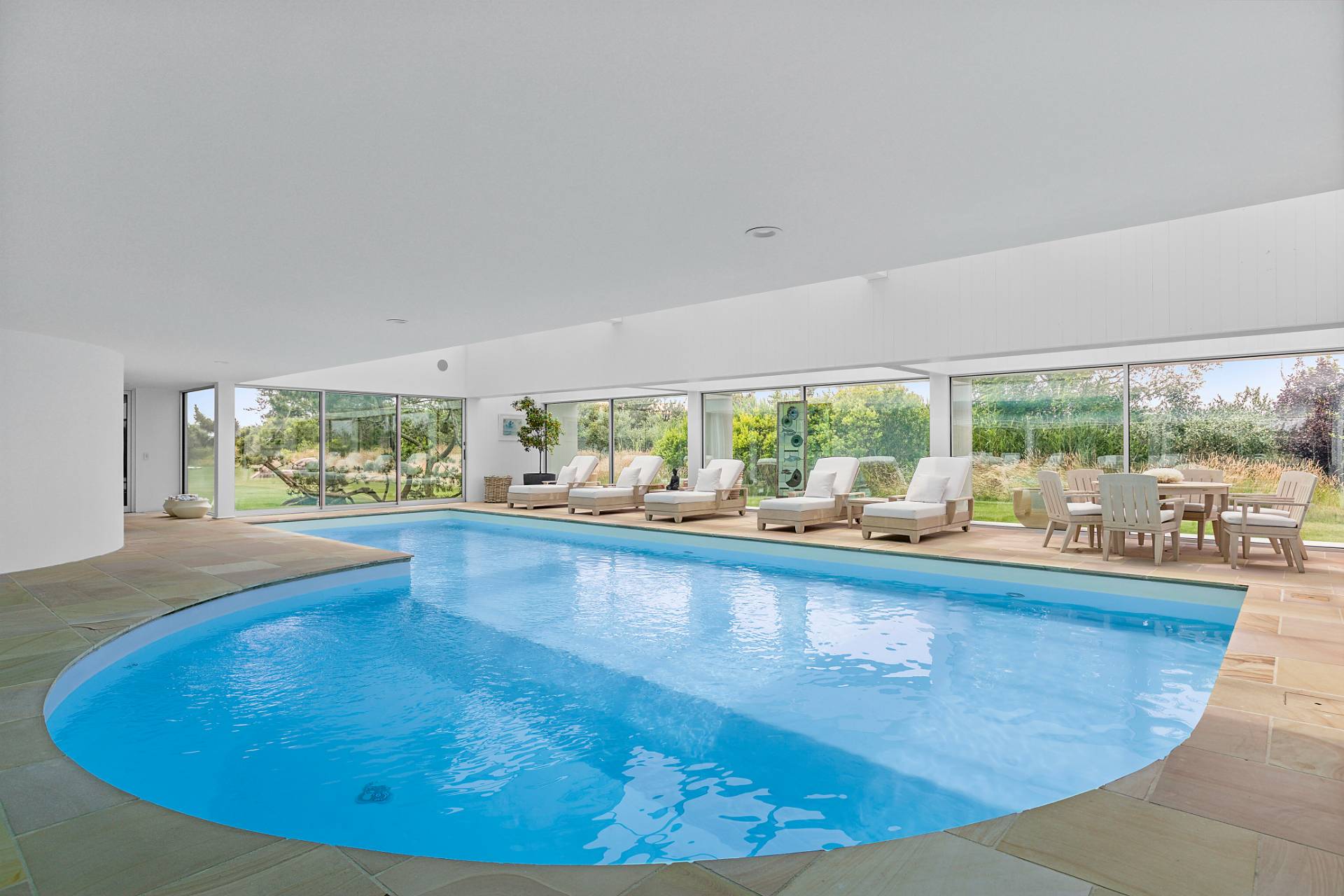 Undisclosed Address Southampton, NY 11968 - Photo 24 of 43 a view of a living room and floor to ceiling window and floor