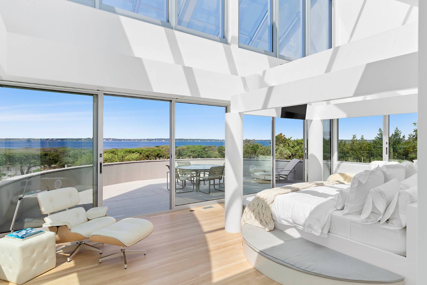 Undisclosed Address Southampton, NY 11968 - Photo 29 of 43 a bed room with a bed and a large window