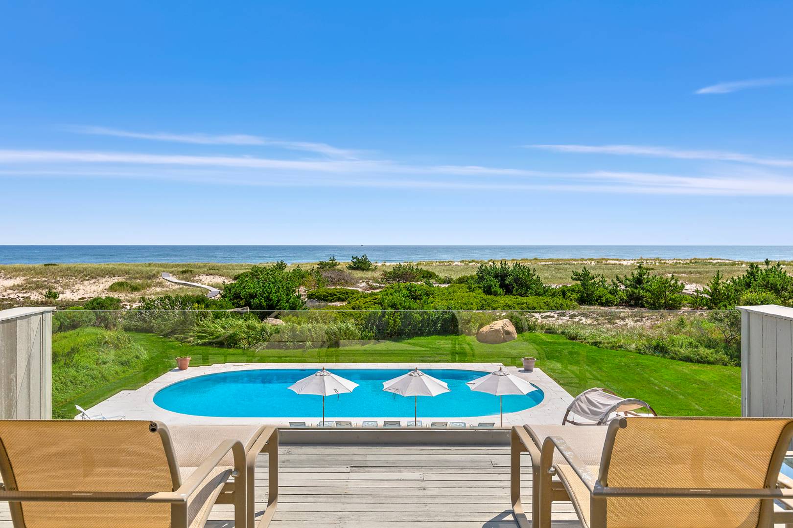 Undisclosed Address Southampton, NY 11968 - Photo 33 of 43 a view of a swimming pool with an outdoor seating and yard