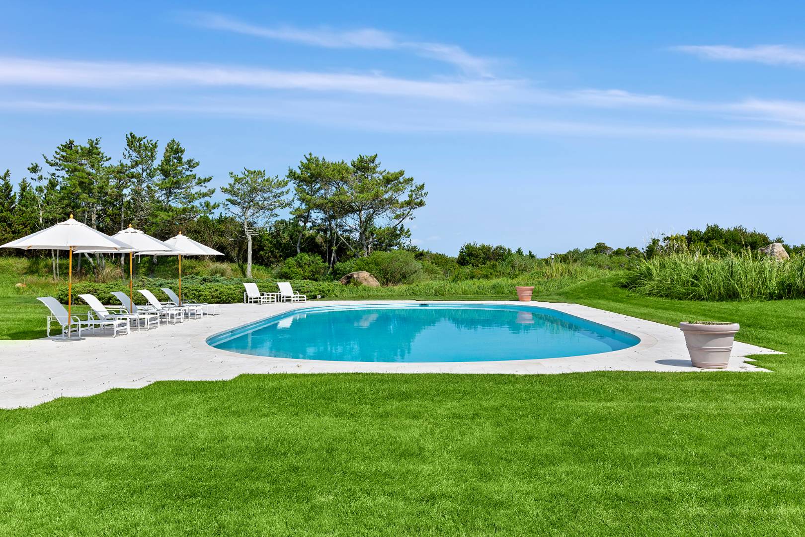 Undisclosed Address Southampton, NY 11968 - Photo 37 of 43 a view of a swimming pool and a yard