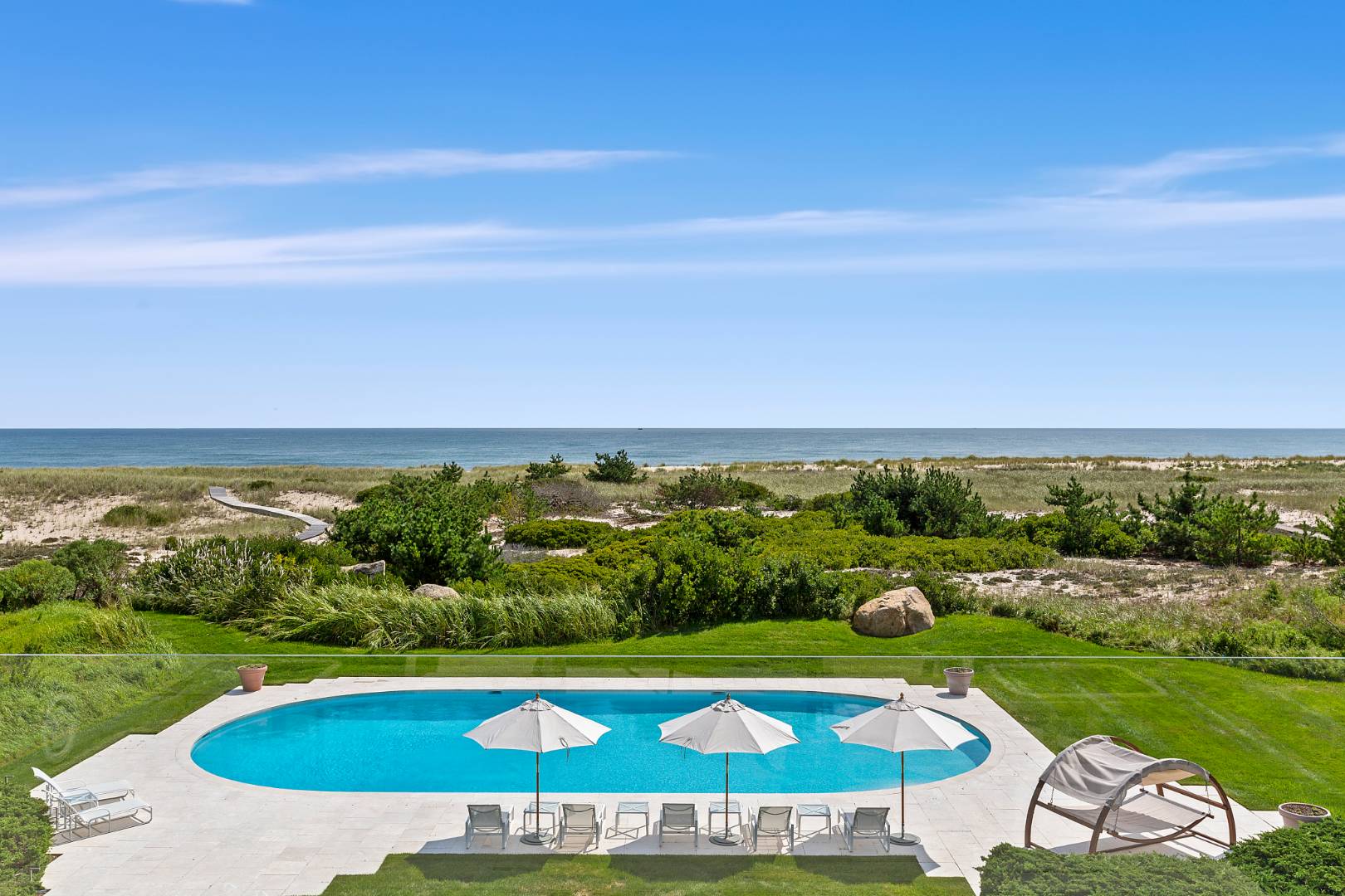 Undisclosed Address Southampton, NY 11968 - Photo 39 of 43 a view of swimming pool and an outdoor seating