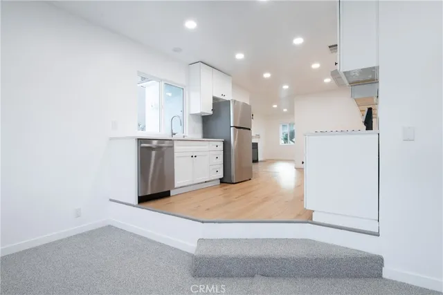 a view of kitchen with wooden floor