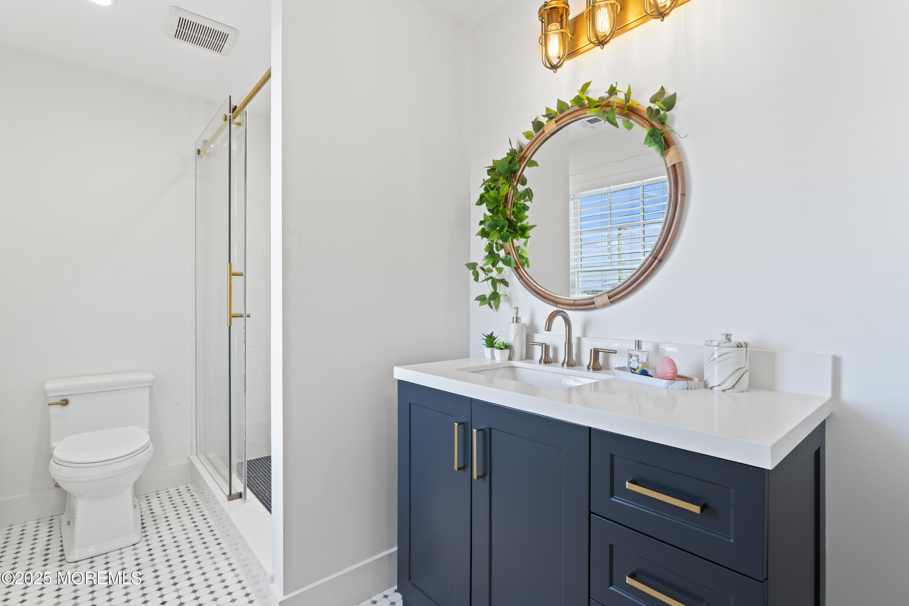 1819 Boat Point Drive Point Pleasant, NJ 08742 - Photo 29 of 48 a bathroom with a sink and a mirror