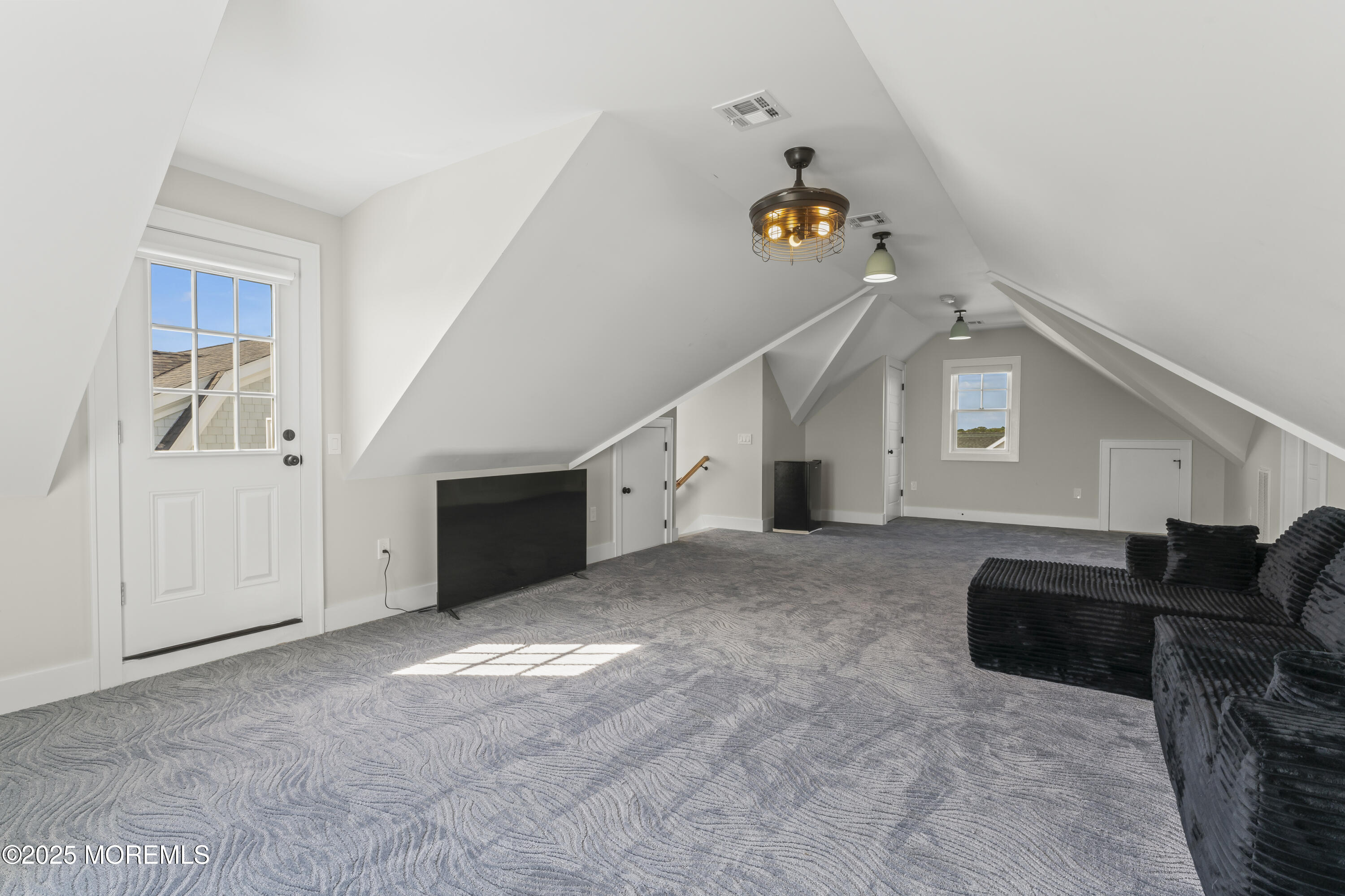 1819 Boat Point Drive Point Pleasant, NJ 08742 - Photo 36 of 48 a view of a livingroom with furniture and staircase