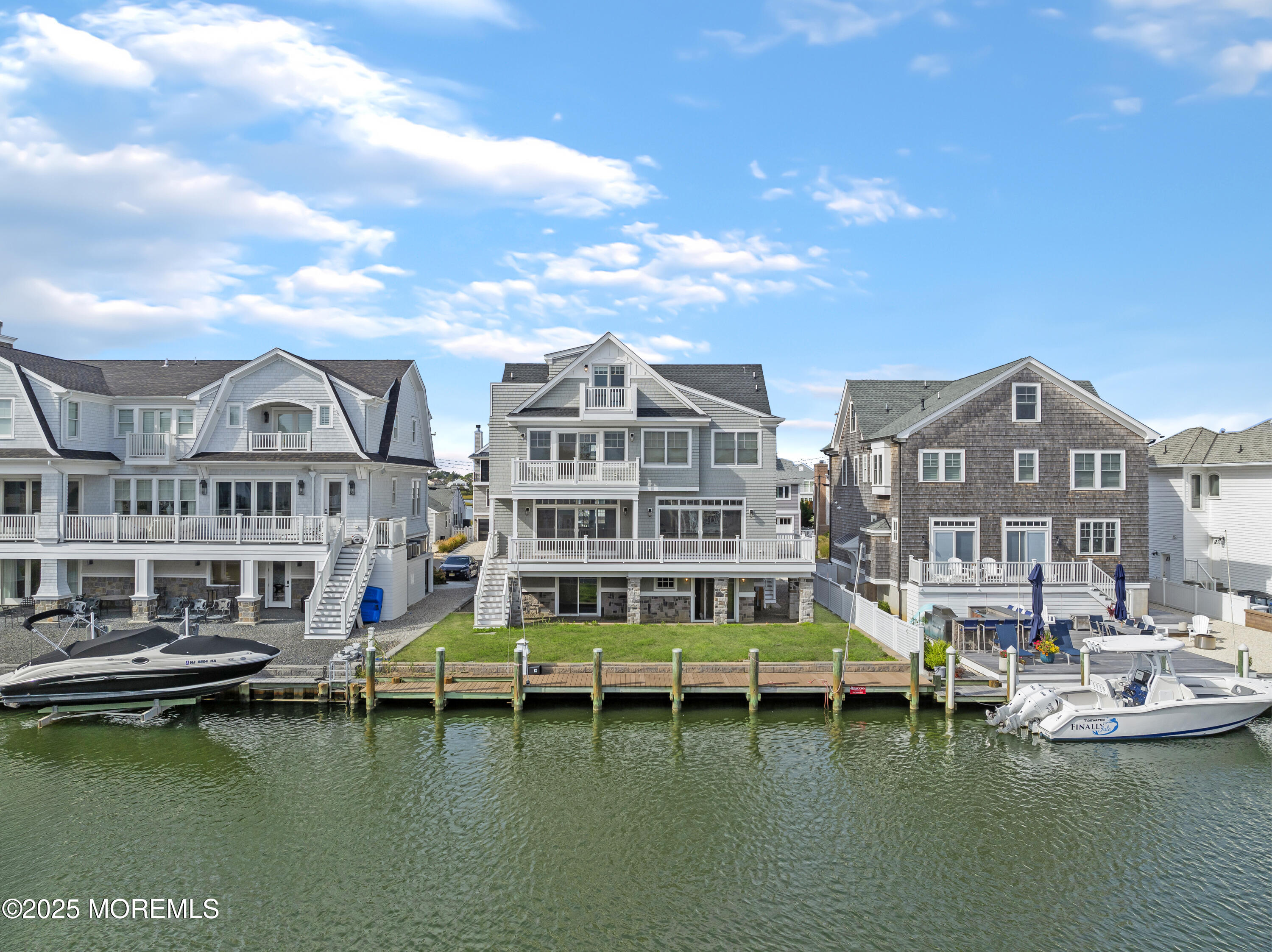 1819 Boat Point Drive Point Pleasant, NJ 08742 - Photo 38 of 48 a view of a lake with building in front of it