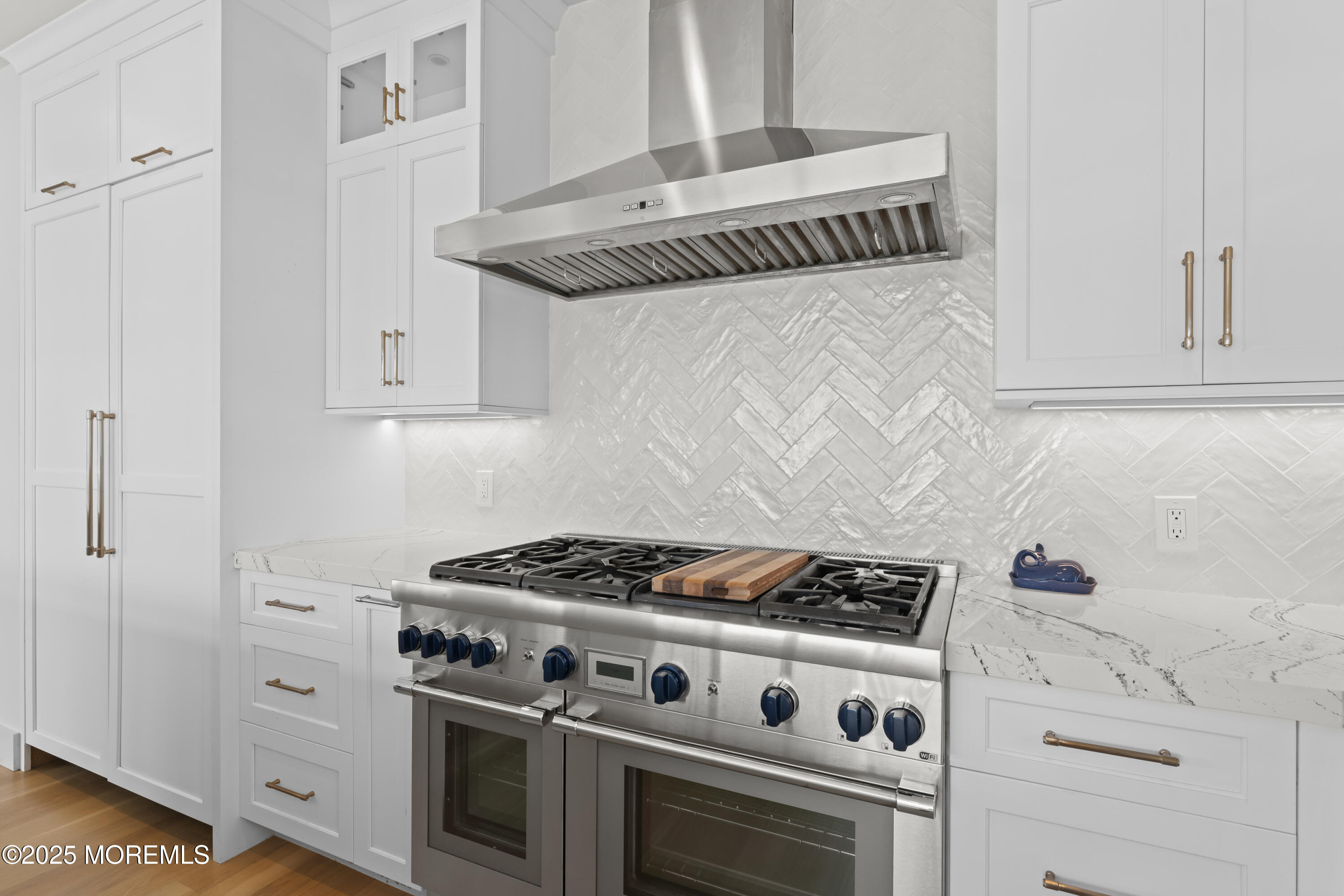 1819 Boat Point Drive Point Pleasant, NJ 08742 - Photo 10 of 48 a kitchen with white cabinets and white stove