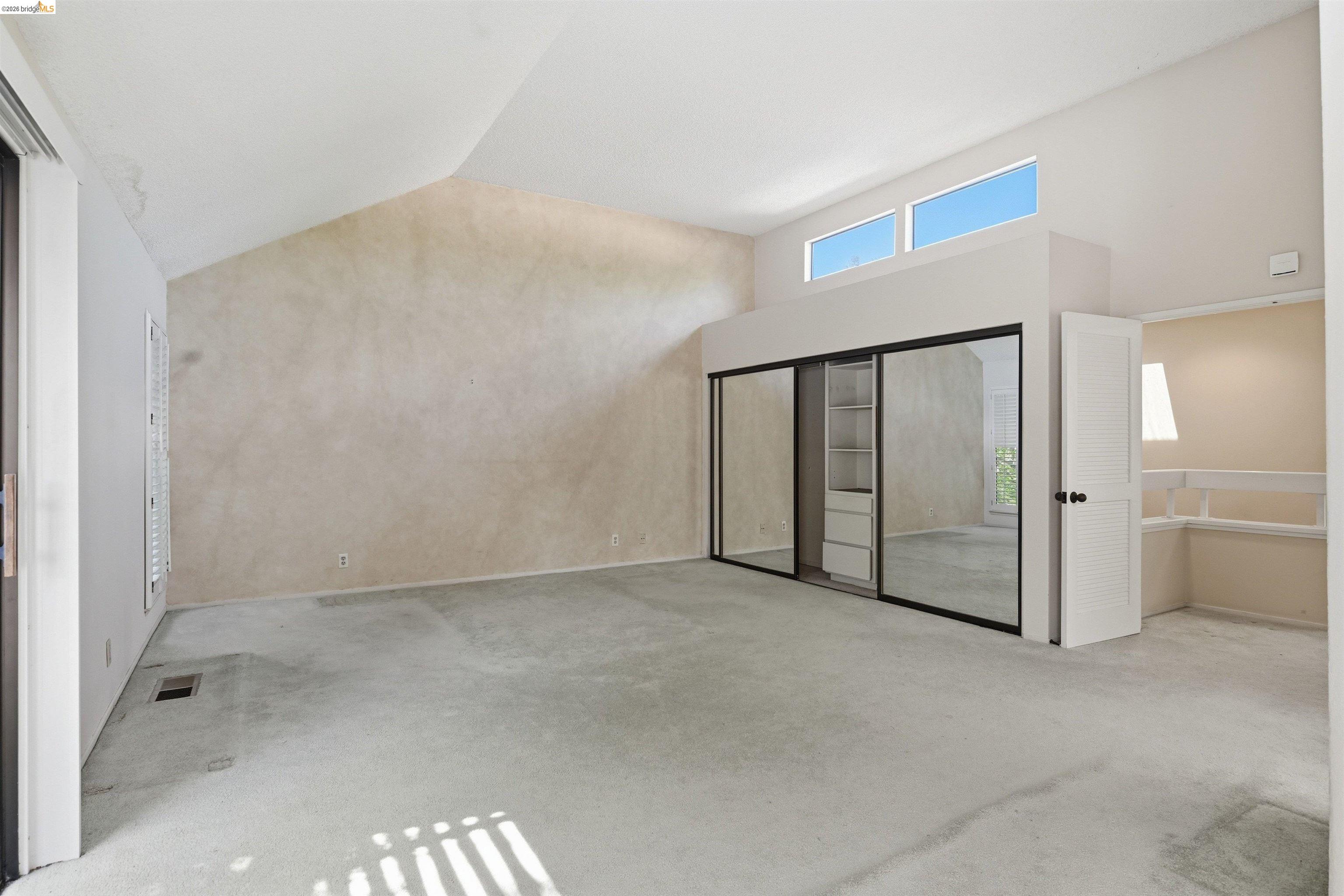 1925 Piper Ridge Court Walnut Creek, CA 94597 - Photo 13 of 27 Unfurnished bedroom featuring light colored carpet and lofted ceiling