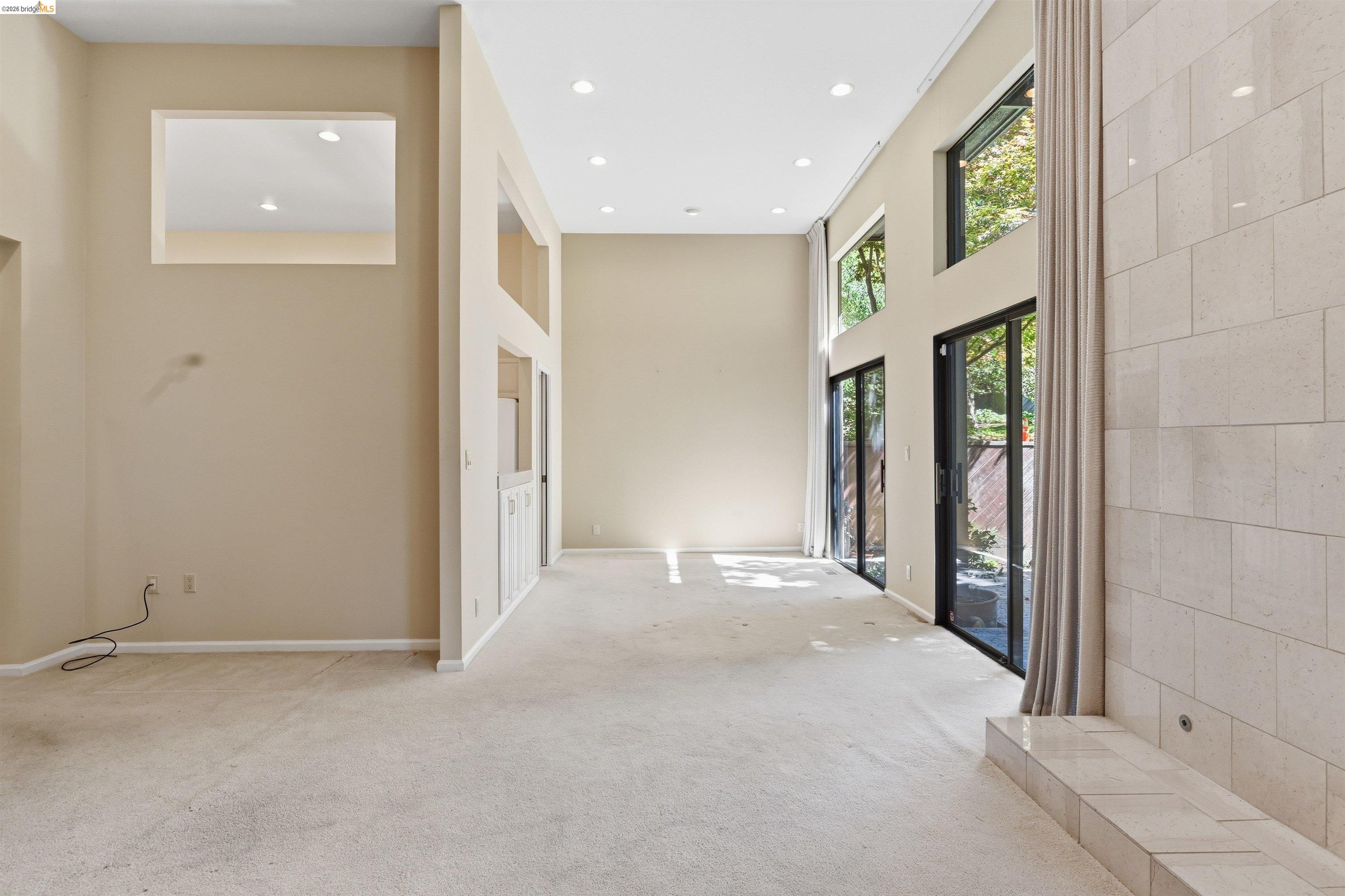 1925 Piper Ridge Court Walnut Creek, CA 94597 - Photo 5 of 27 Hallway with a high ceiling, light colored carpet, and recessed lighting