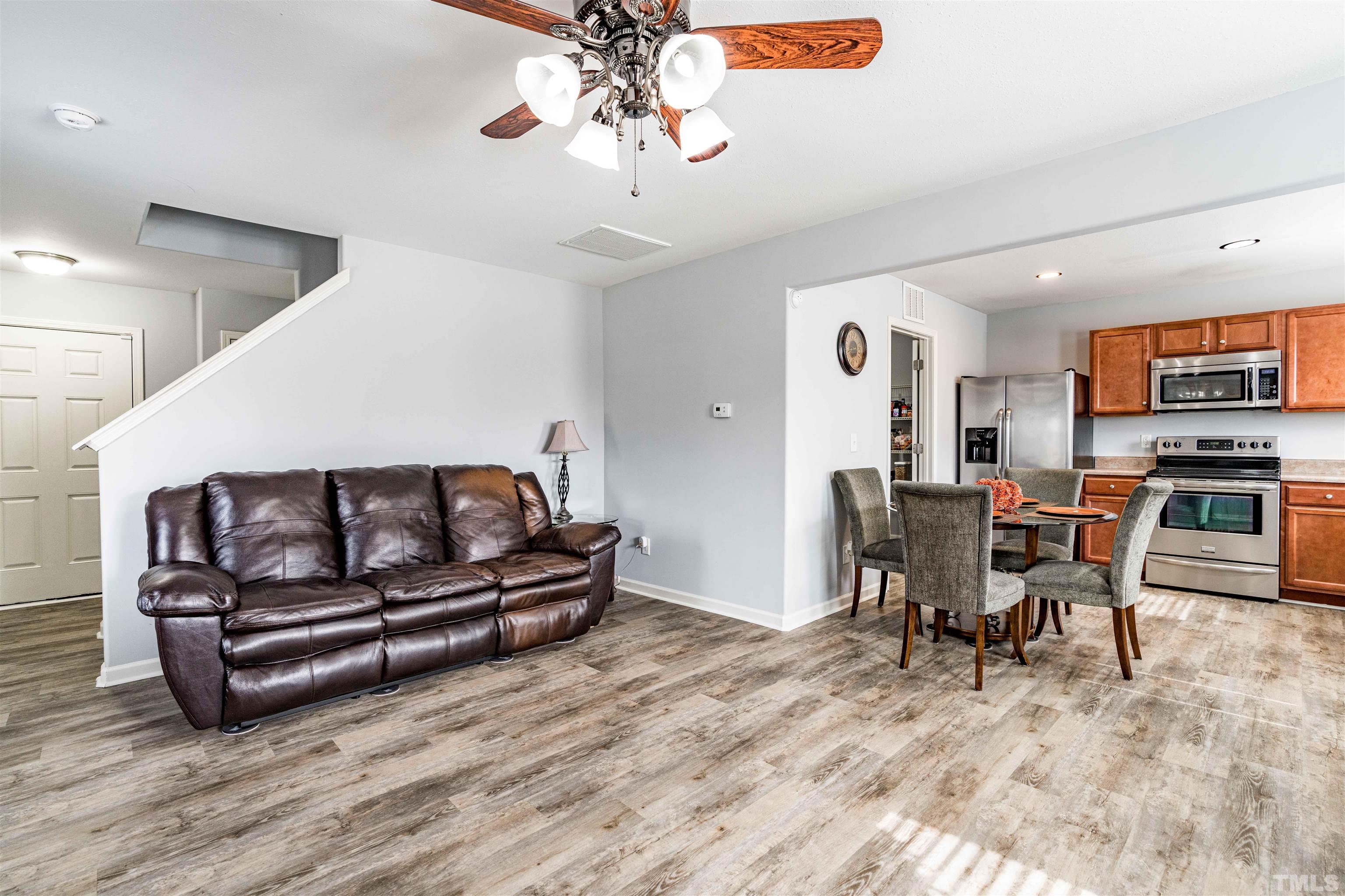 3902 Evans Drive Raleigh, NC 27610 - Photo 11 of 31 a living room with furniture and a wooden floor