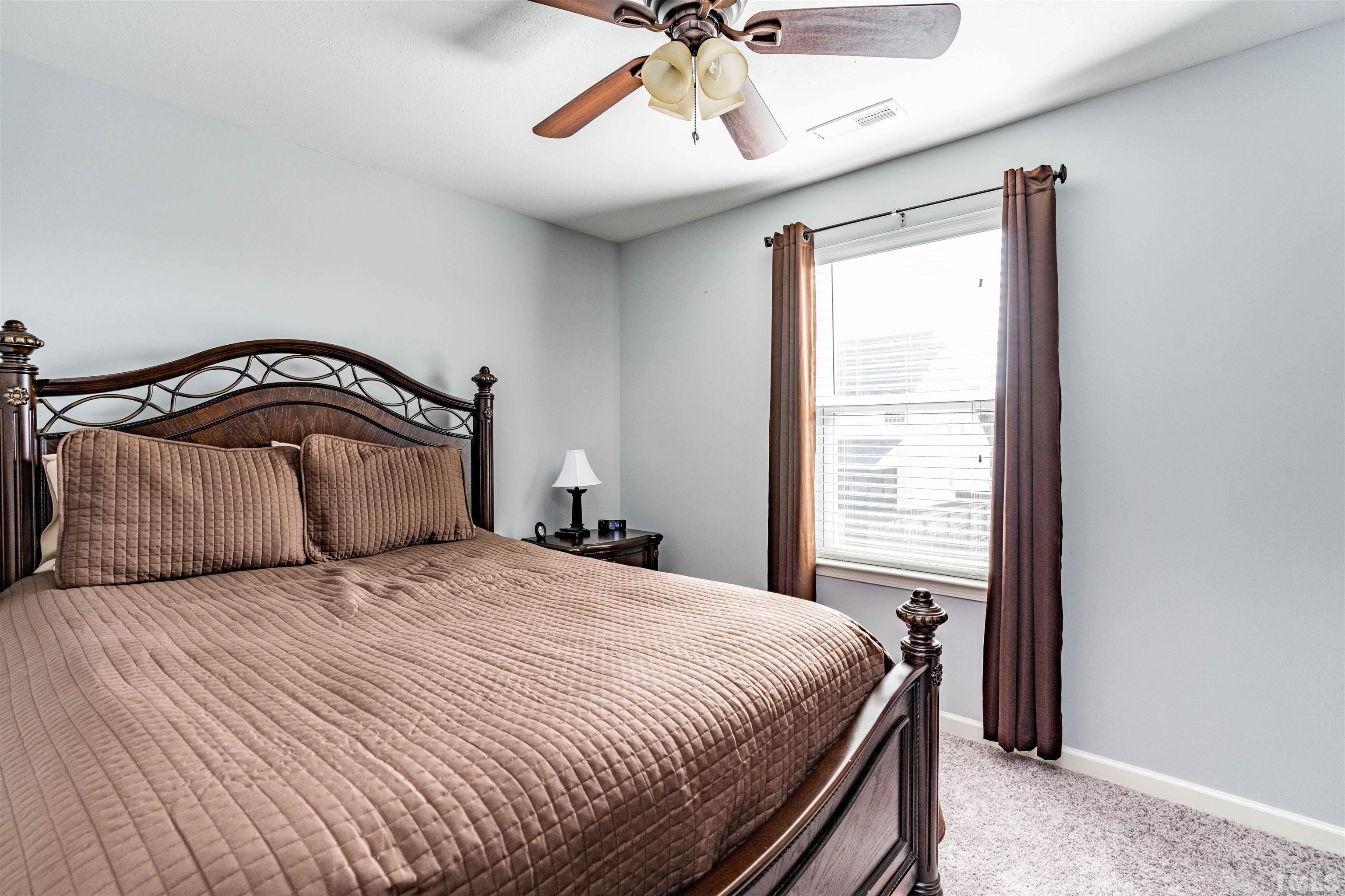 3902 Evans Drive Raleigh, NC 27610 - Photo 29 of 31 a bedroom with a bed and window
