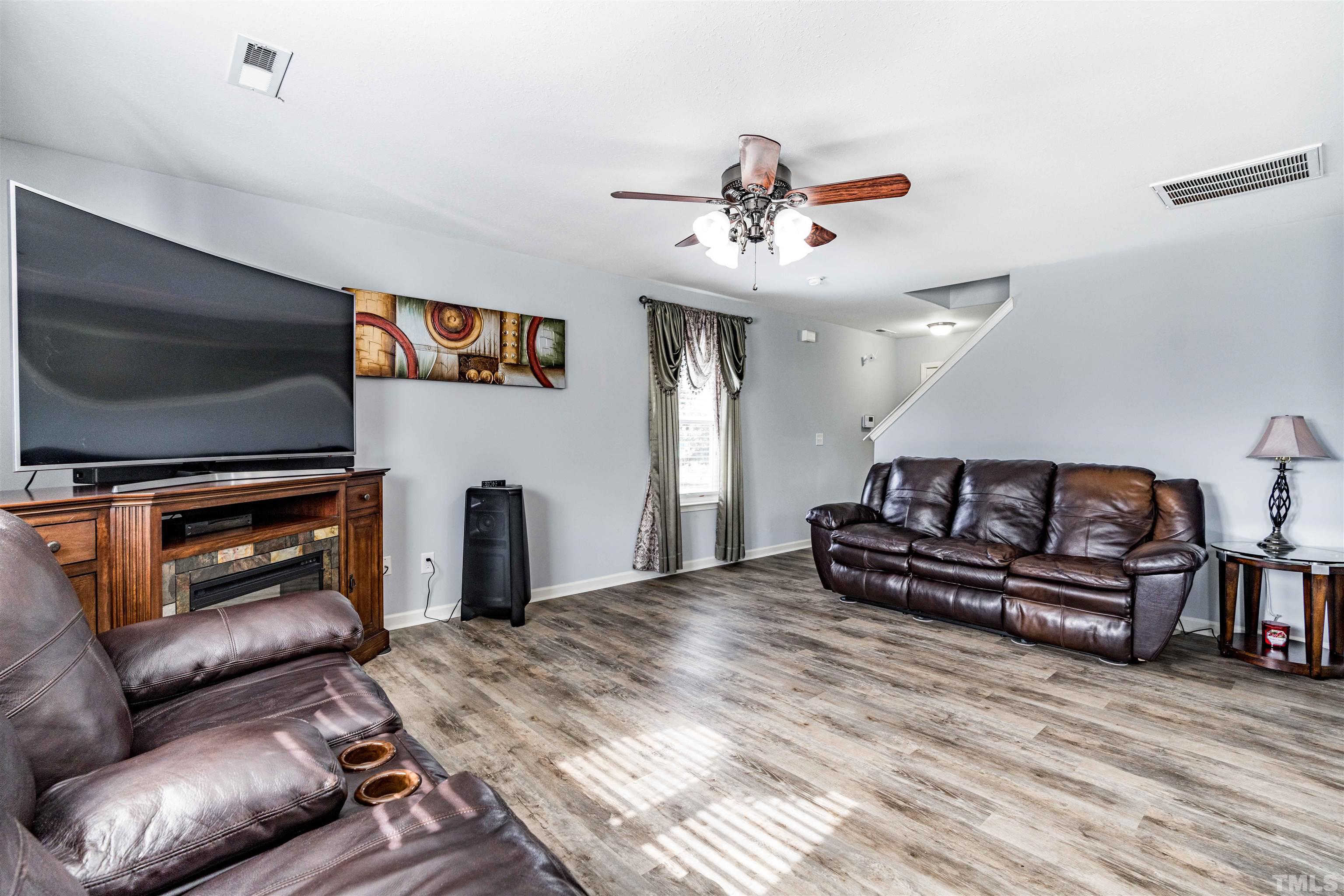 3902 Evans Drive Raleigh, NC 27610 - Photo 10 of 31 a living room with furniture and a flat screen tv