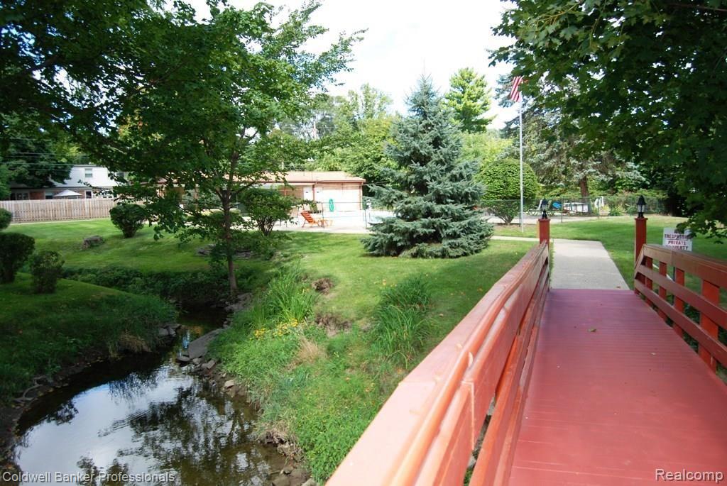 1199 South Sheldon Road, Unit 41 Plymouth, MI 48170 - Photo 2 of 17 View of Creek and Pool