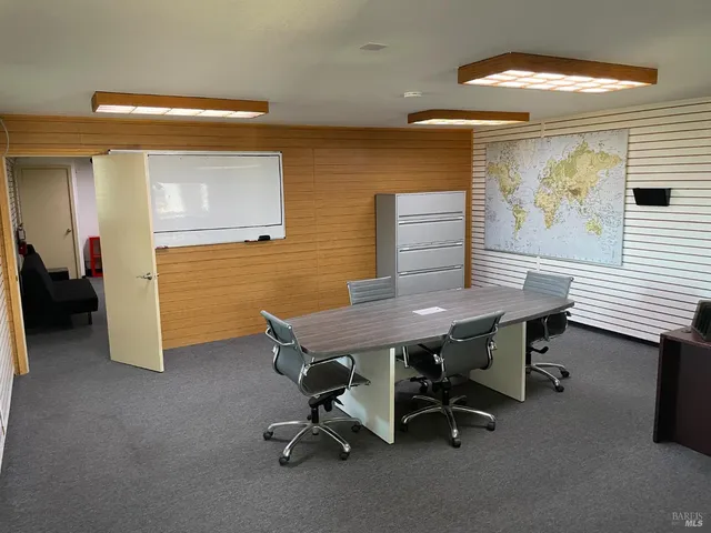 a view of a workspace with furniture