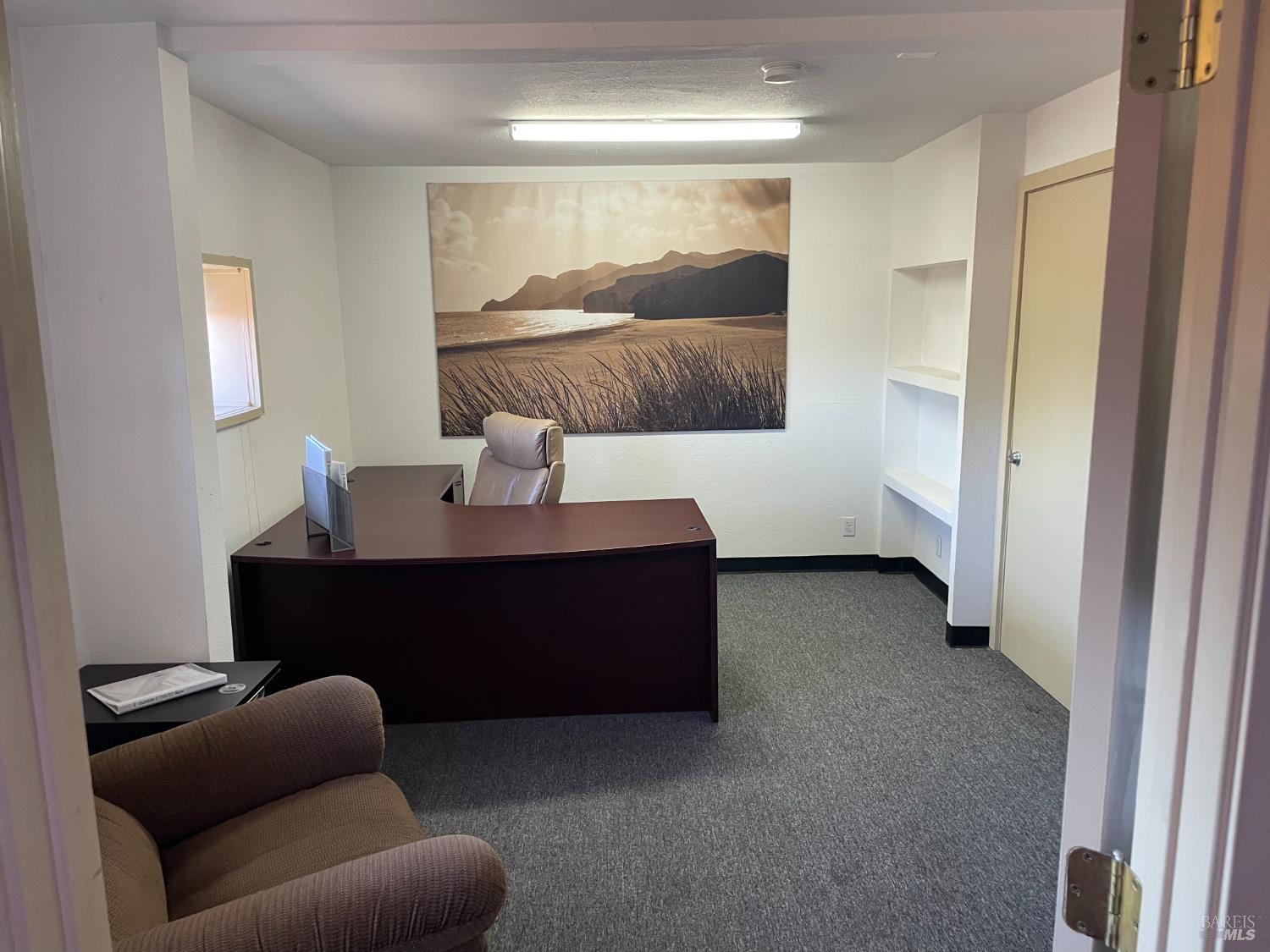 3753 Santa Rosa Avenue, Unit B Santa Rosa, CA 95407 - Photo 17 of 34 a living room with furniture and a lamp