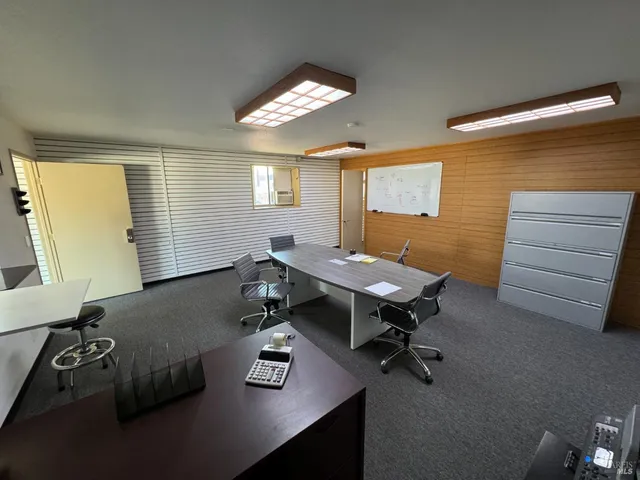 a view of a workspace with furniture