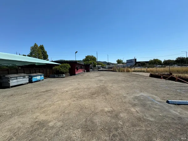 a view of street with parked cars
