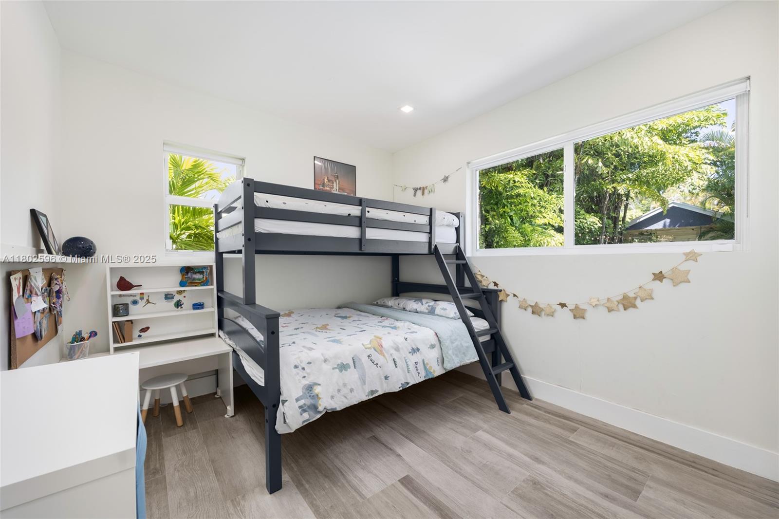 2478 Inagua Avenue Coconut Grove, FL 33133 - Photo 19 of 40 a bedroom with a bed and a window