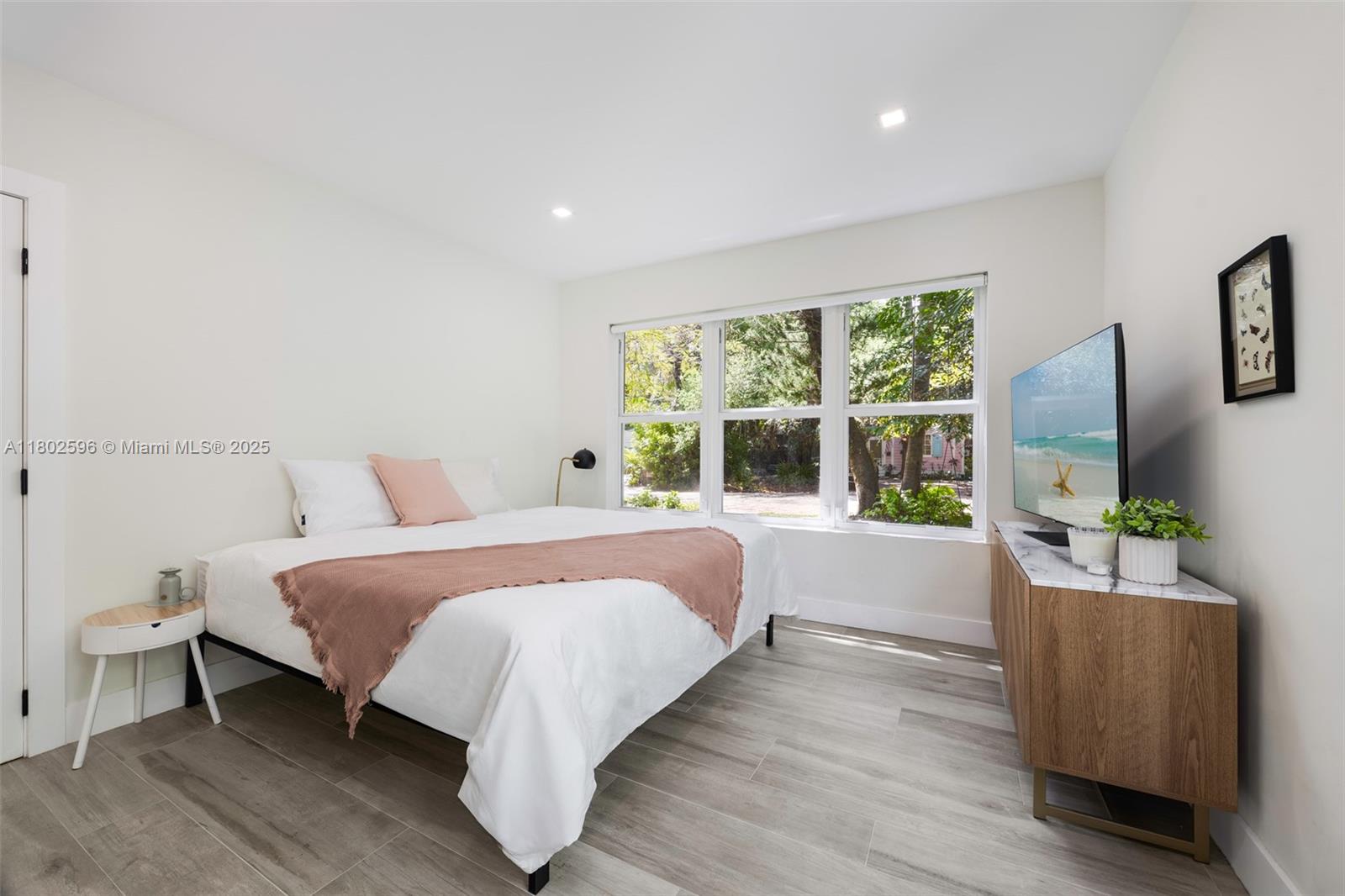 2478 Inagua Avenue Coconut Grove, FL 33133 - Photo 21 of 40 a bedroom with bed and a flat screen tv