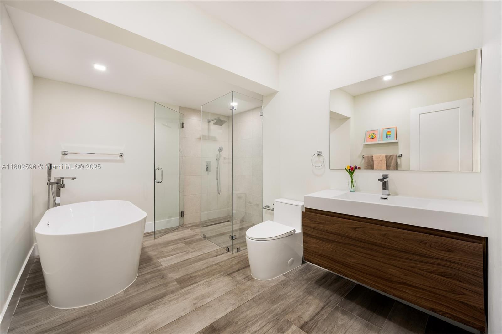 2478 Inagua Avenue Coconut Grove, FL 33133 - Photo 24 of 40 a bathroom with a double vanity sink mirror and toilet