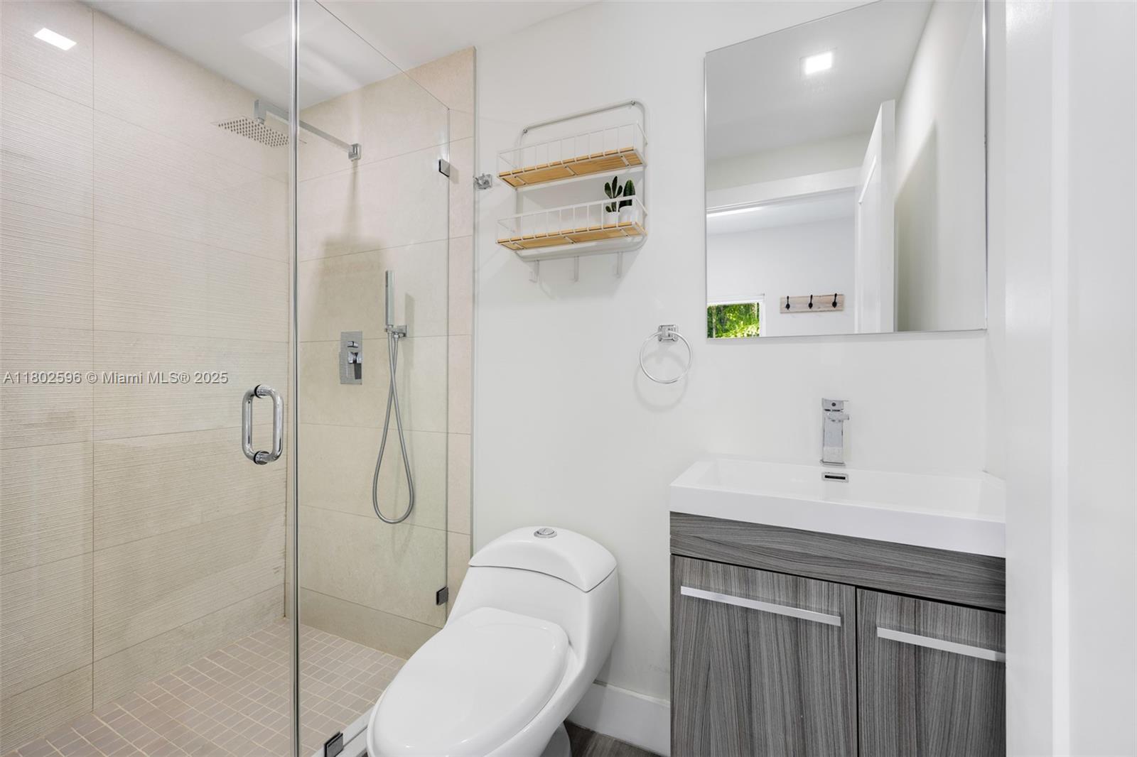 2478 Inagua Avenue Coconut Grove, FL 33133 - Photo 27 of 40 a bathroom with a sink toilet and shower