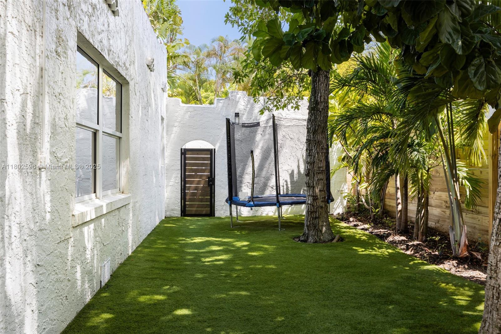 2478 Inagua Avenue Coconut Grove, FL 33133 - Photo 33 of 40 a view of a porch with a tree