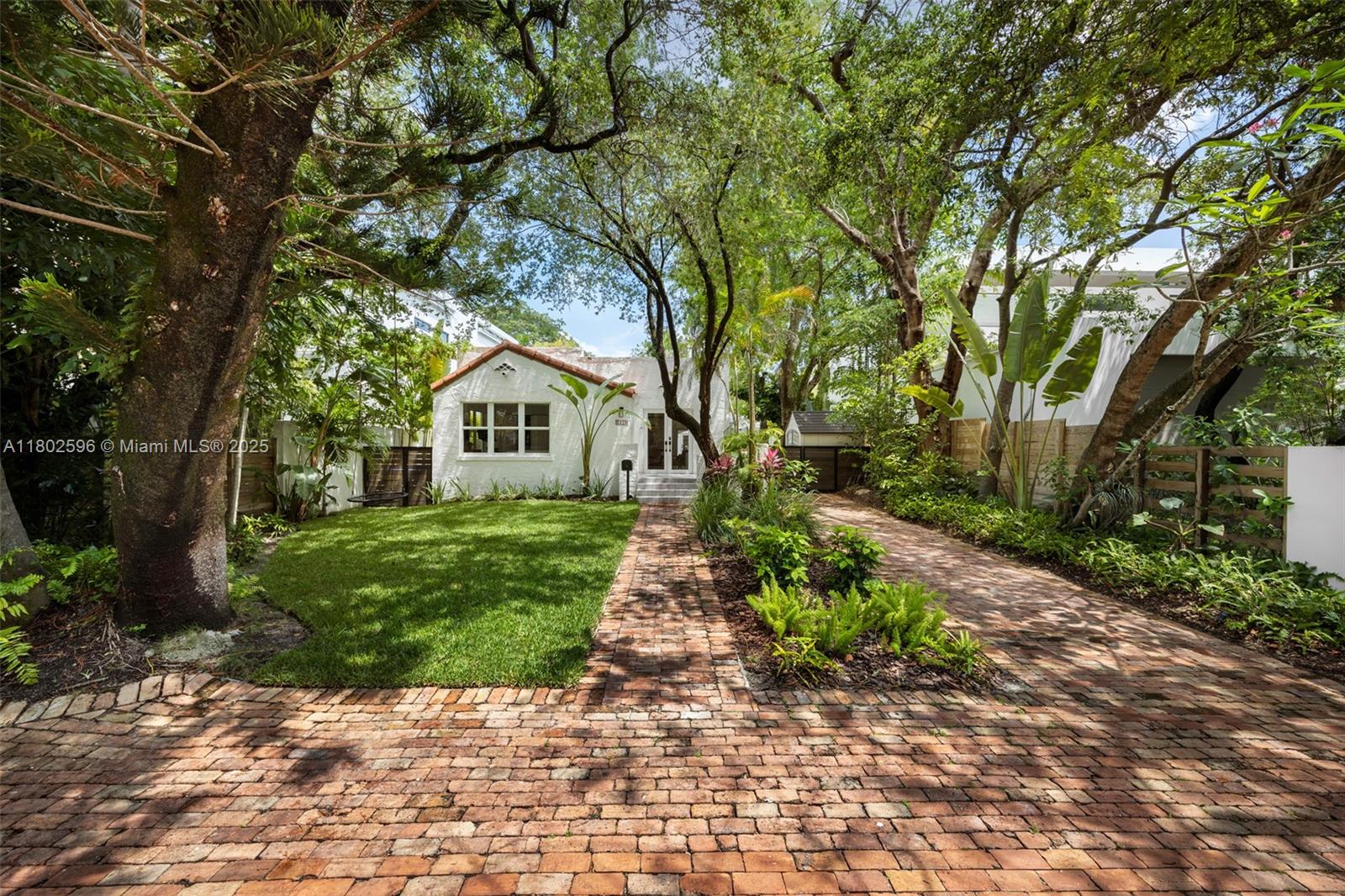 2478 Inagua Avenue Coconut Grove, FL 33133 - Photo 4 of 40 a house with trees in front of it