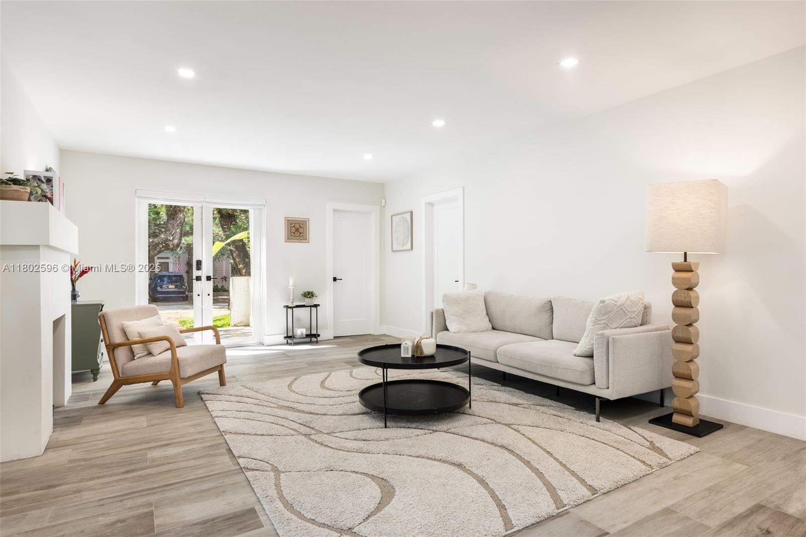 2478 Inagua Avenue Coconut Grove, FL 33133 - Photo 5 of 40 a living room with furniture and a wooden floor