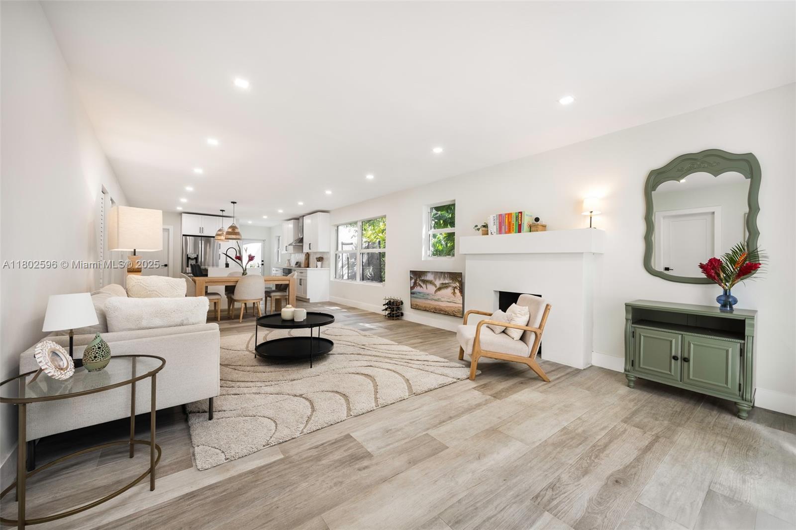 2478 Inagua Avenue Coconut Grove, FL 33133 - Photo 6 of 40 a living room with furniture and a wooden floor