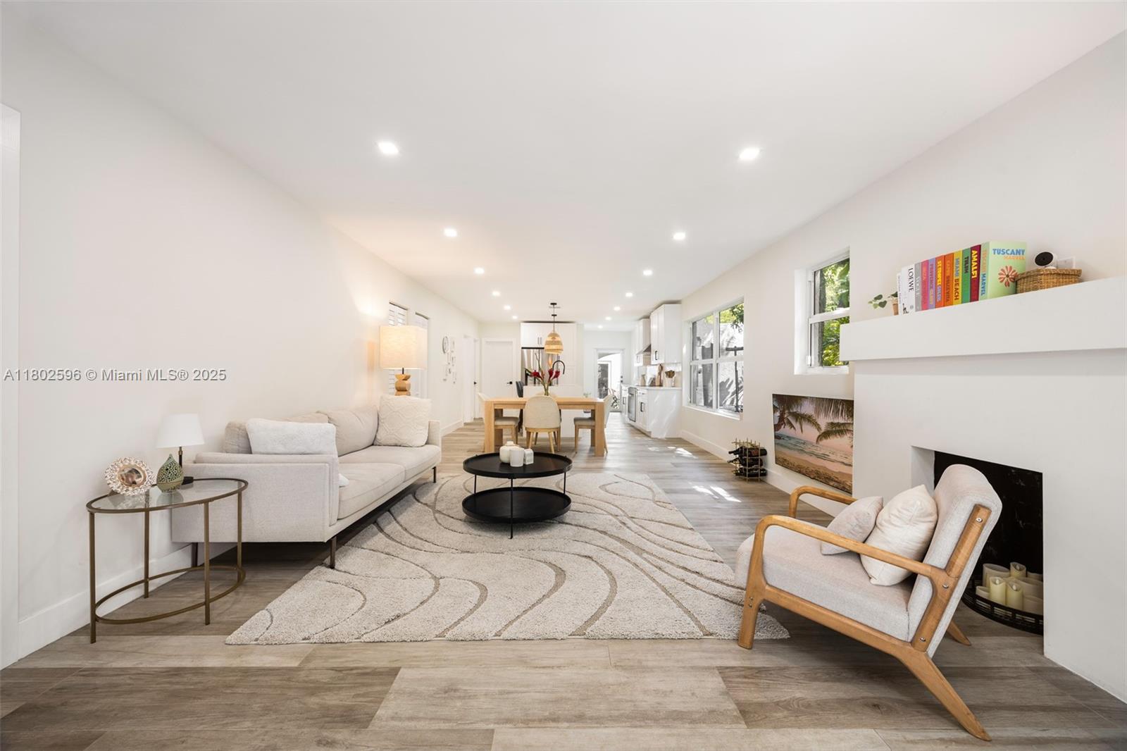 2478 Inagua Avenue Coconut Grove, FL 33133 - Photo 7 of 40 a living room with furniture and a fireplace