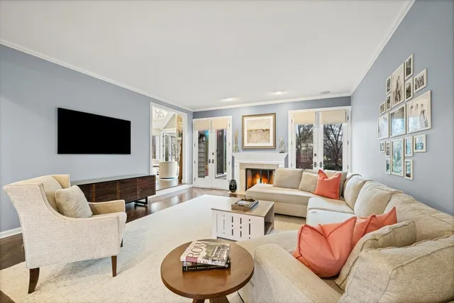 a living room with furniture fireplace and a flat screen tv