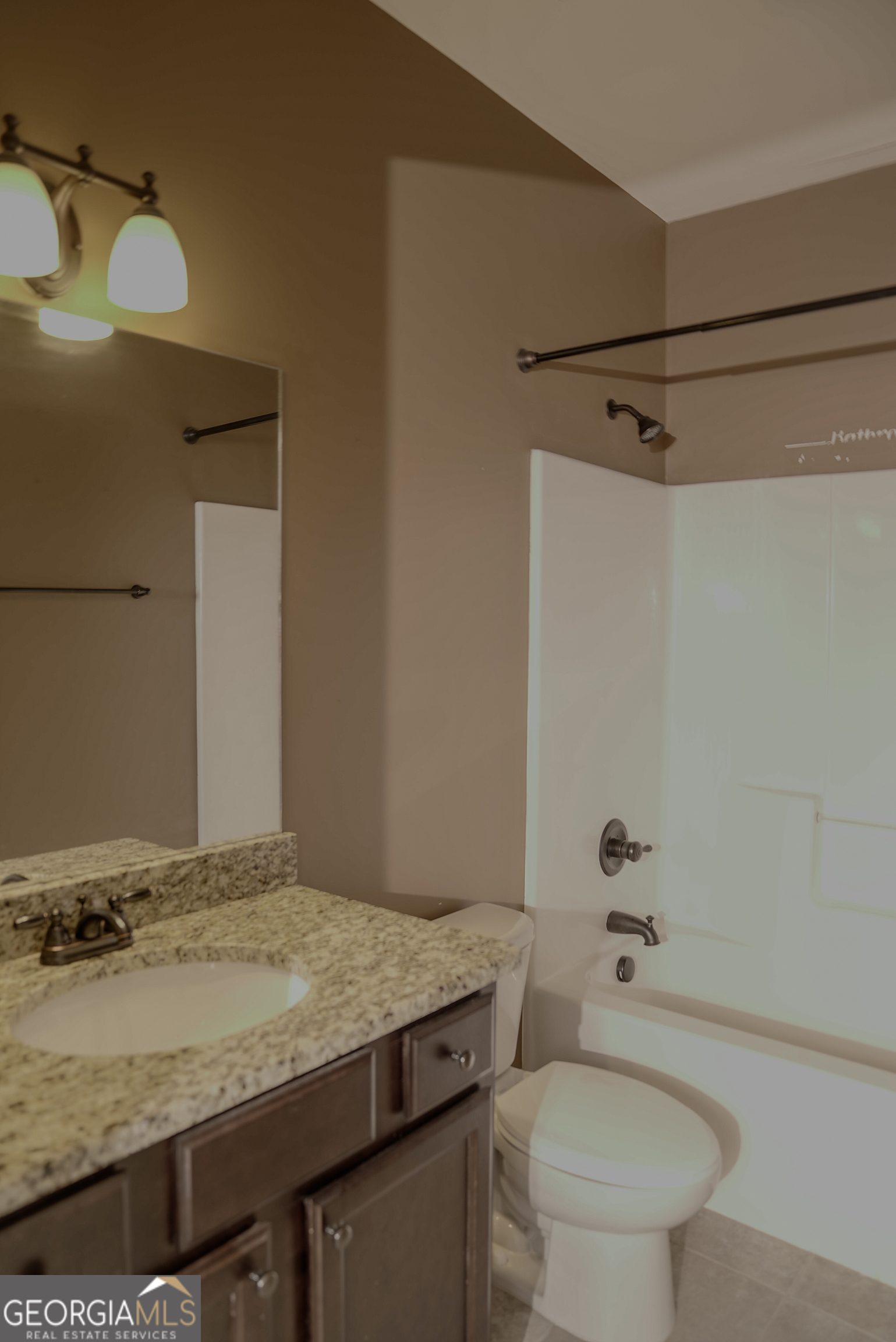 505 Mirror Lake Parkway Villa Rica, GA 30180 - Photo 15 of 28 a bathroom with a granite countertop sink toilet and shower