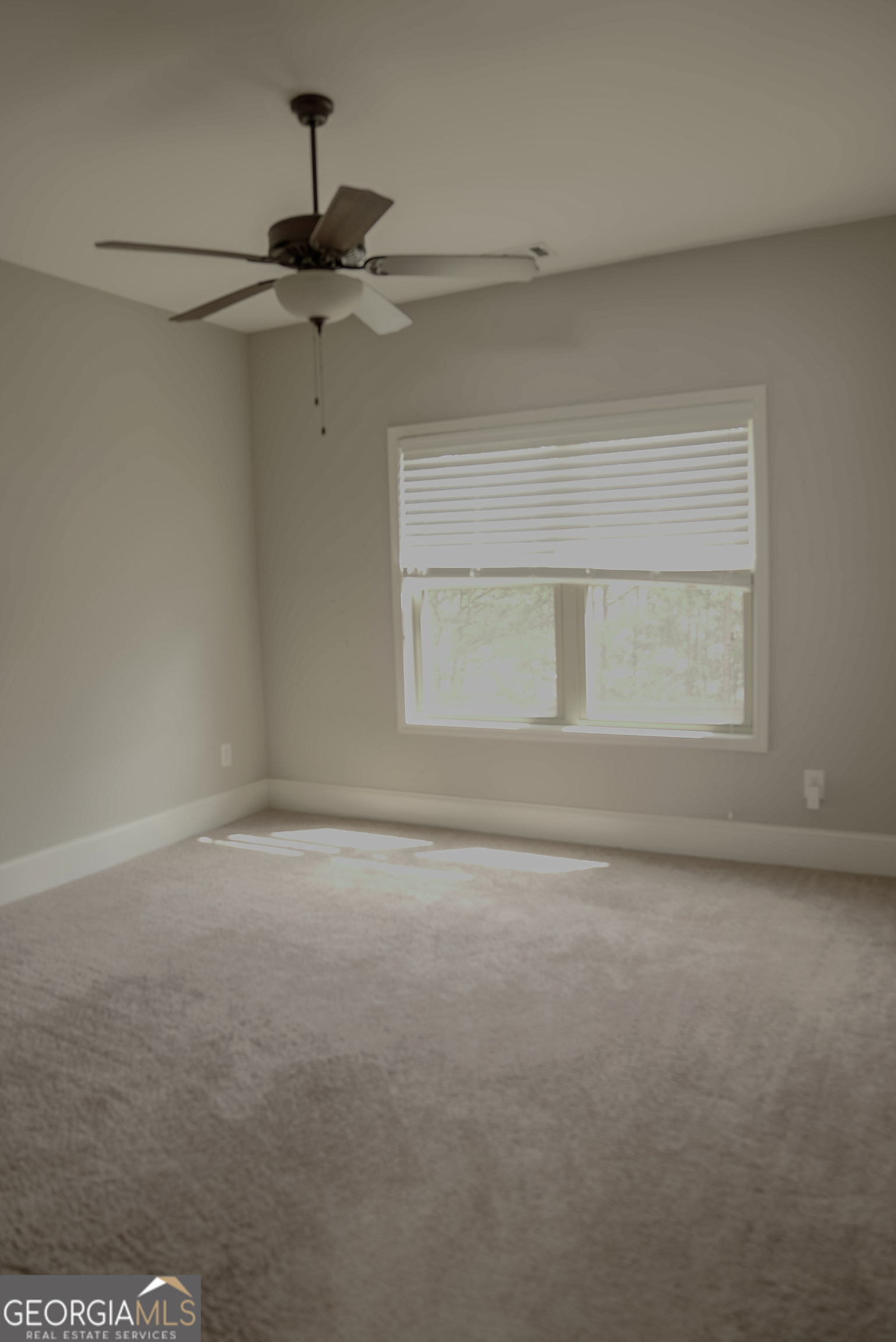 505 Mirror Lake Parkway Villa Rica, GA 30180 - Photo 18 of 28 a view of an empty room with a window