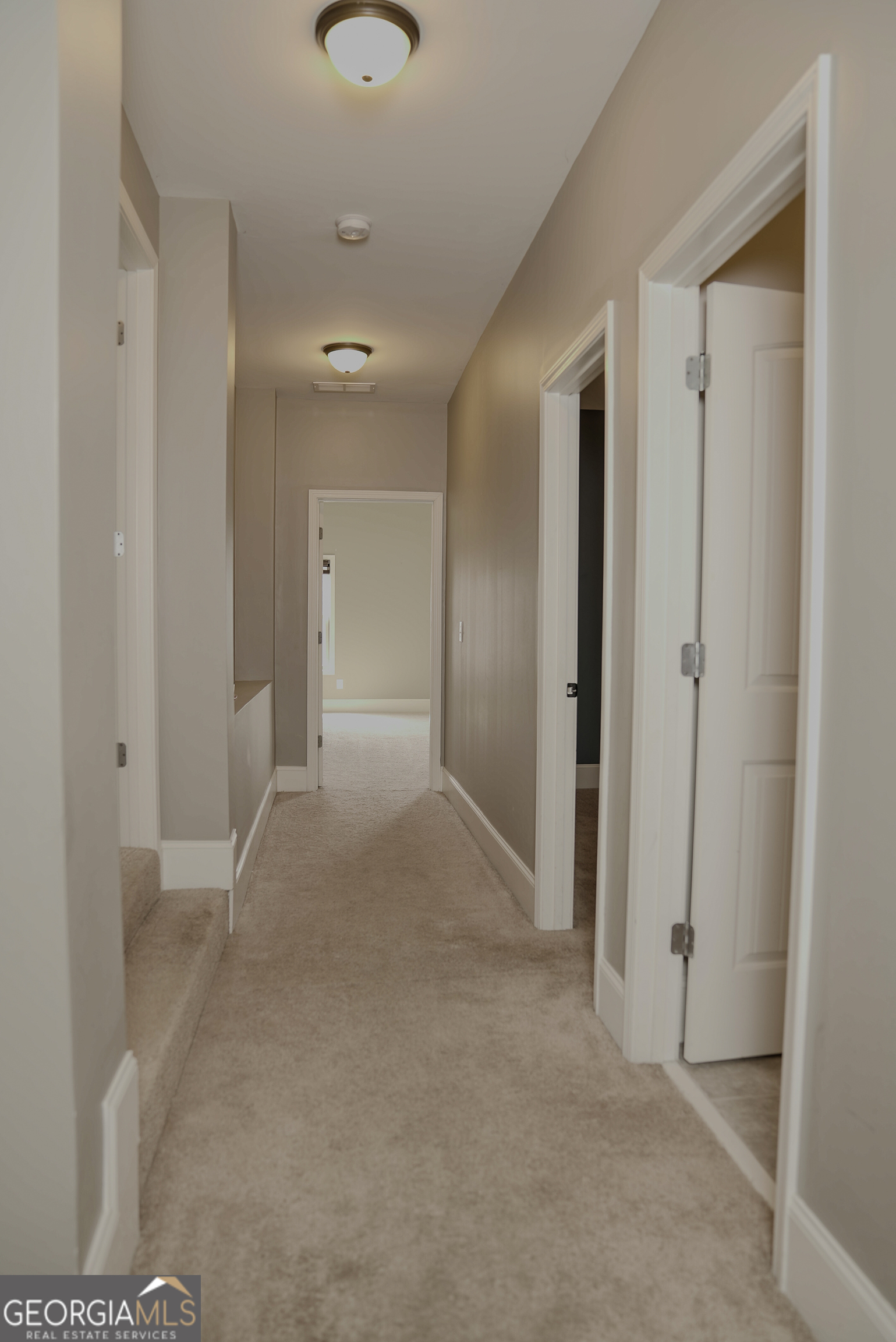 505 Mirror Lake Parkway Villa Rica, GA 30180 - Photo 21 of 28 a view of a hallway with wooden shelves