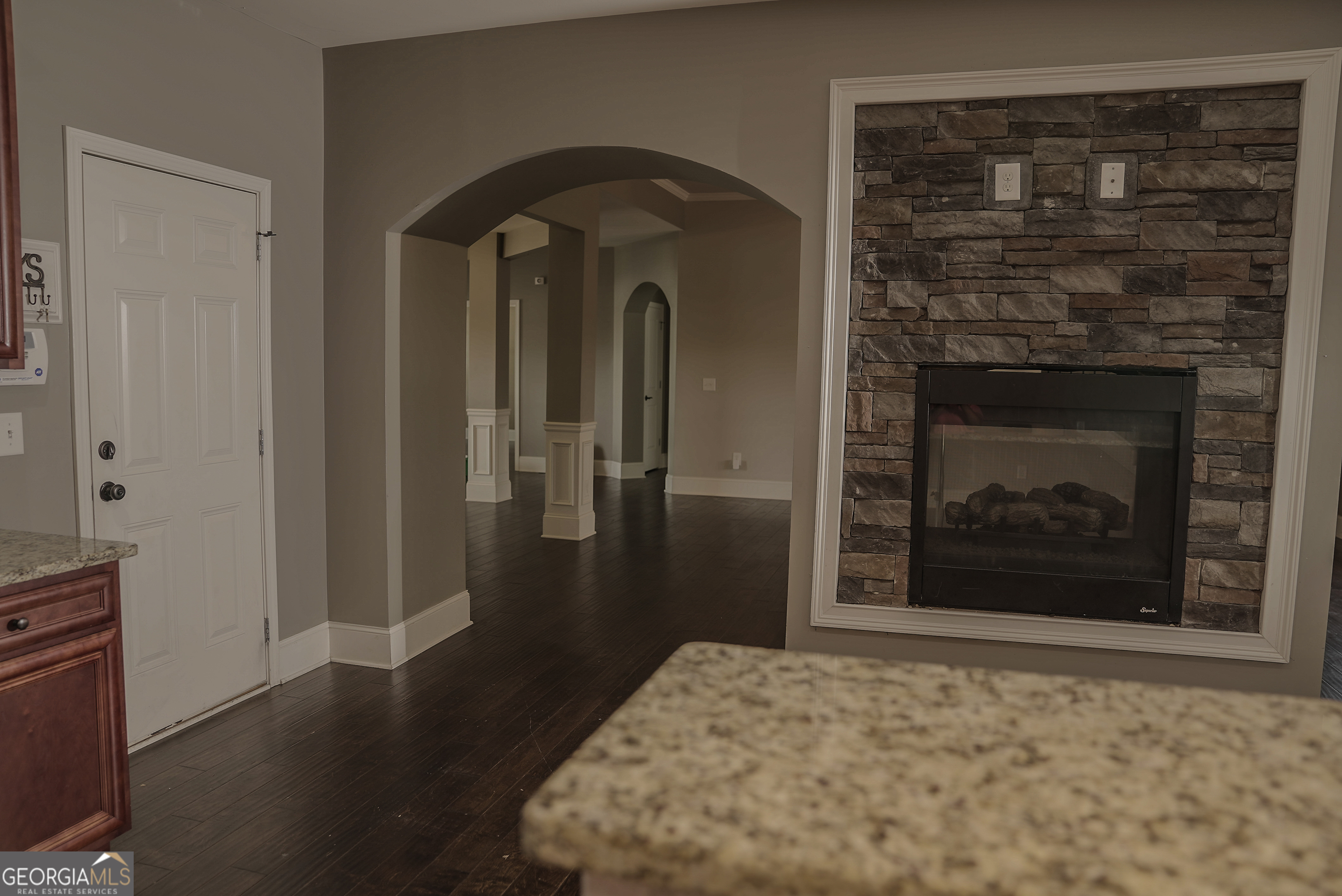 505 Mirror Lake Parkway Villa Rica, GA 30180 - Photo 8 of 28 a view of a livingroom with wooden floor and a fireplace