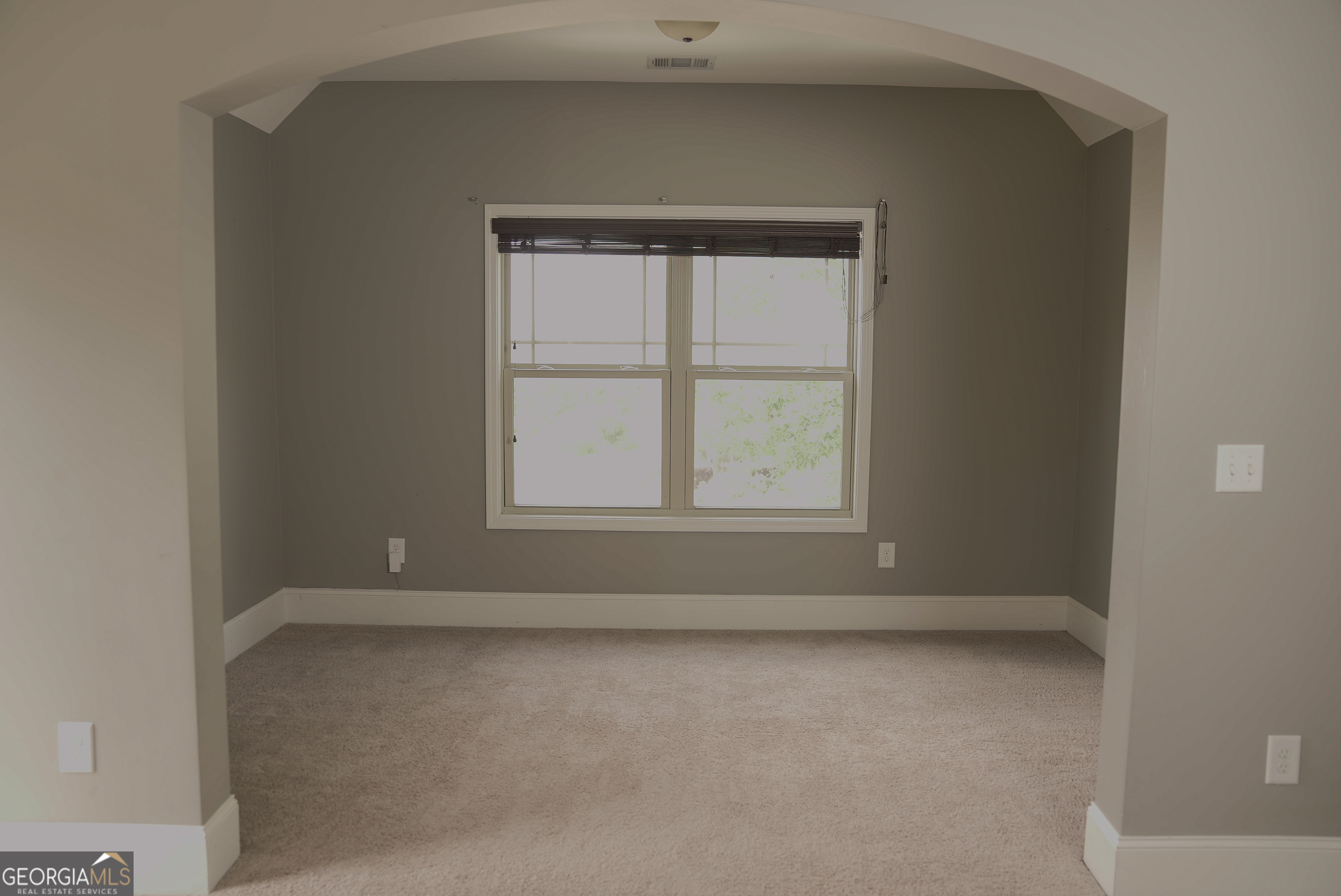 505 Mirror Lake Parkway Villa Rica, GA 30180 - Photo 9 of 28 an empty room with a window