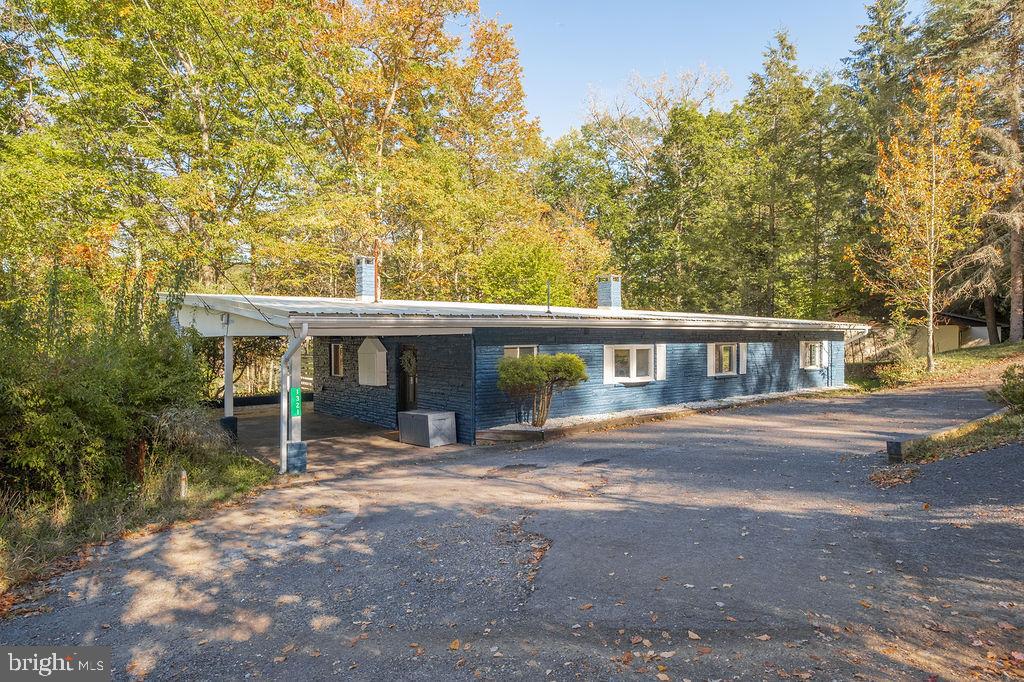 1321 Marsh Hill Road McHenry, MD 21541 - Photo 1 of 42 a view of a house with a yard and garage