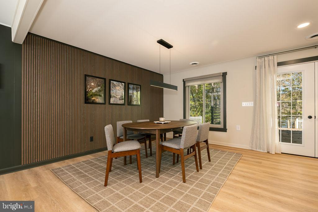 1321 Marsh Hill Road McHenry, MD 21541 - Photo 11 of 42 a dining room with a wooden table and chairs