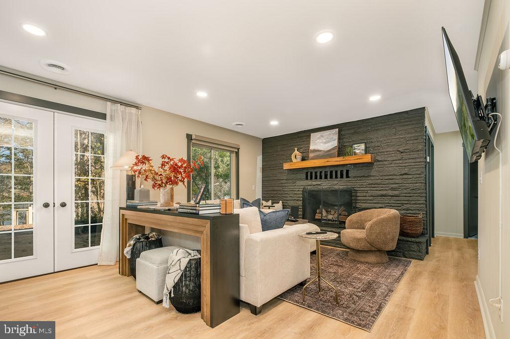 1321 Marsh Hill Road McHenry, MD 21541 - Photo 12 of 42 a living room with furniture a fireplace and a flat screen tv
