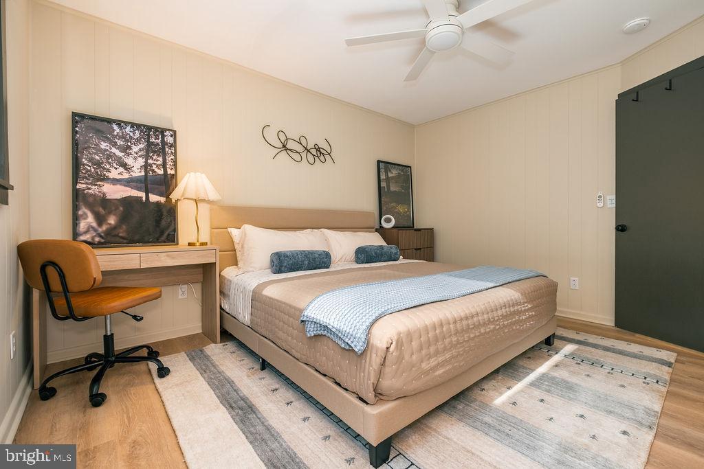 1321 Marsh Hill Road McHenry, MD 21541 - Photo 17 of 42 a bedroom with a bed and a chair