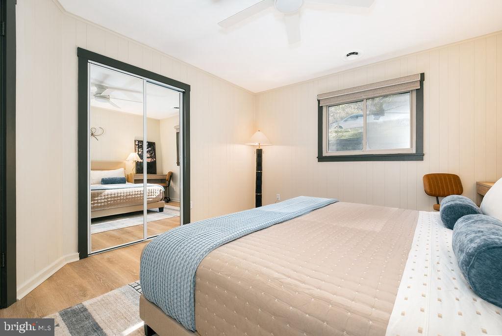 1321 Marsh Hill Road McHenry, MD 21541 - Photo 18 of 42 a bedroom with a large bed and a painting on the wall