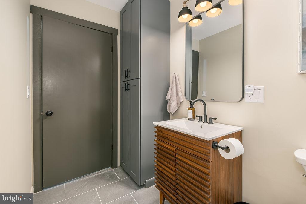 1321 Marsh Hill Road McHenry, MD 21541 - Photo 21 of 42 a bathroom with a sink a mirror and a toilet