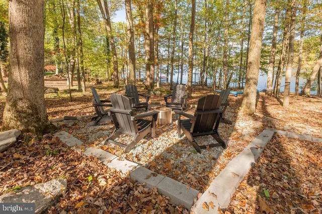 a view of outdoor space with table and chairs