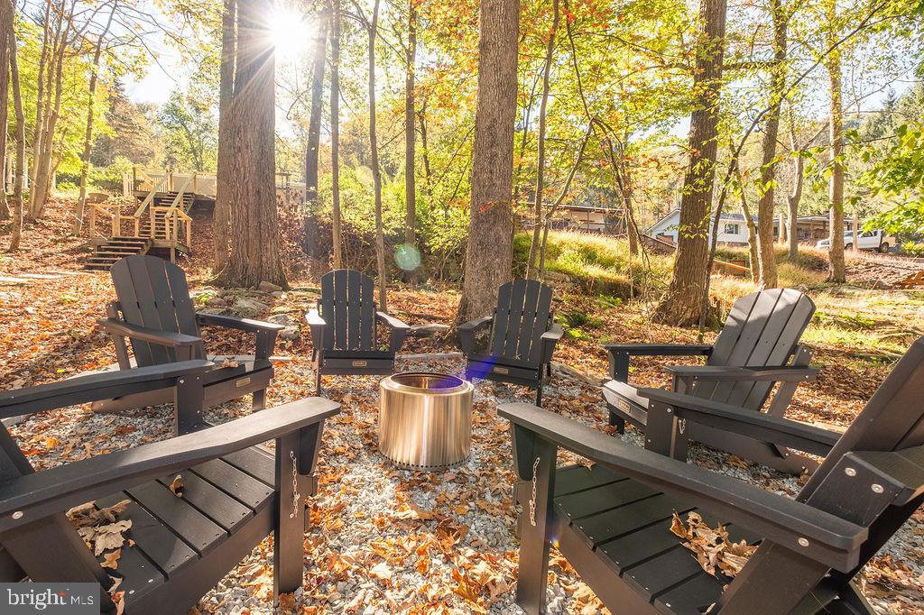 1321 Marsh Hill Road McHenry, MD 21541 - Photo 39 of 42 a living room with furniture and a floor to ceiling window
