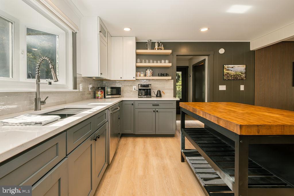 1321 Marsh Hill Road McHenry, MD 21541 - Photo 5 of 42 a kitchen with kitchen island a sink stainless steel appliances and cabinets