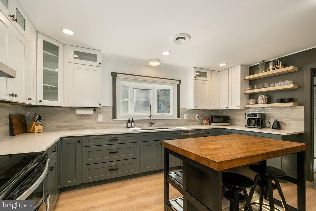 1321 Marsh Hill Road McHenry, MD 21541 - Photo 6 of 42 a kitchen with a sink a stove and cabinets