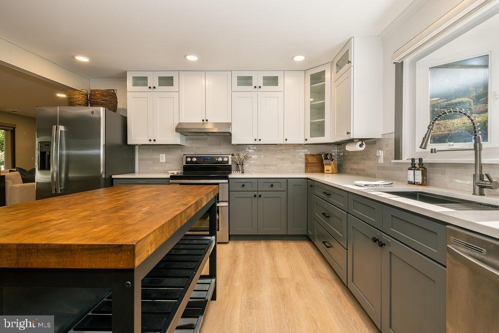 1321 Marsh Hill Road McHenry, MD 21541 - Photo 7 of 42 a kitchen with stainless steel appliances kitchen island granite countertop a sink and cabinets