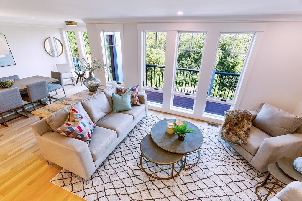 163 Atlantic Road, Unit 6 Gloucester, MA 01930 - Photo 11 of 22 a living room with furniture and a large window