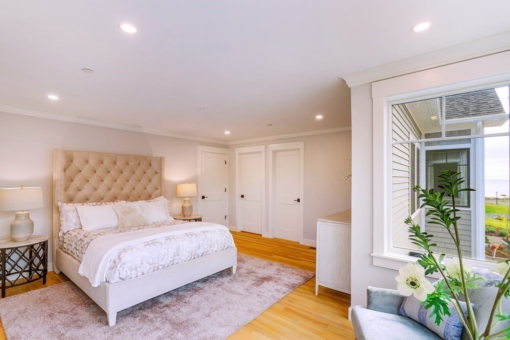 163 Atlantic Road, Unit 6 Gloucester, MA 01930 - Photo 13 of 22 a bedroom with a bed and a potted plant