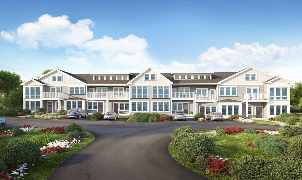 163 Atlantic Road, Unit 6 Gloucester, MA 01930 - Photo 3 of 22 a front view of a residential apartment building with a yard